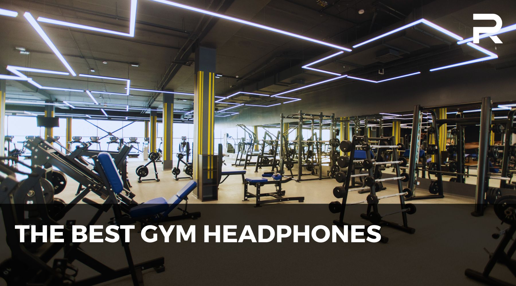 A view inside an empty gym, with text saying The Best Gym Headphones